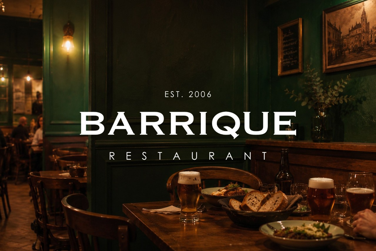 Interiér reštaurácie BARRIQUE Žilina s logom, pivom a chlebom na stole